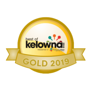 A gold medal with the best of kelowna 2 0 1 9 logo.