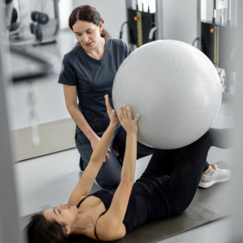 Women helping women exercise.